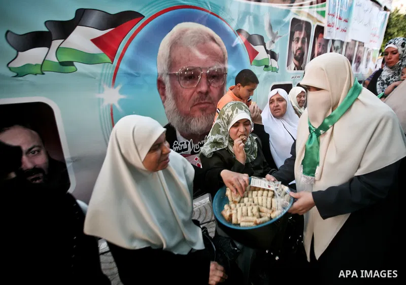 Relatives of Palestinian prisoners held in Israeli jails celebrate after the signing of a deal to end the prisoners hunger strike in Gaza City on 14 May 2012. Israel and Palestinian signed an agreement 14 May ending a ma...