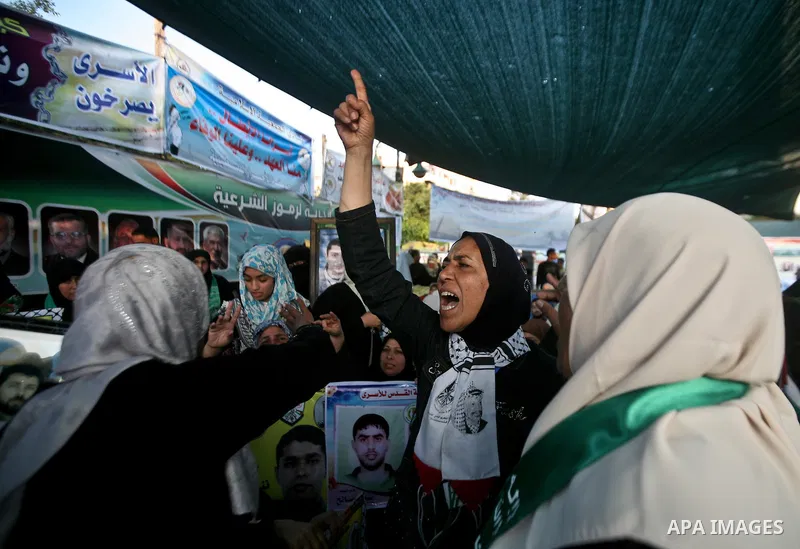 Relatives of Palestinian prisoners held in Israeli jails celebrate after the signing of a deal to end the prisoners hunger strike in Gaza City on 14 May 2012. Israel and Palestinian signed an agreement 14 May ending a ma...