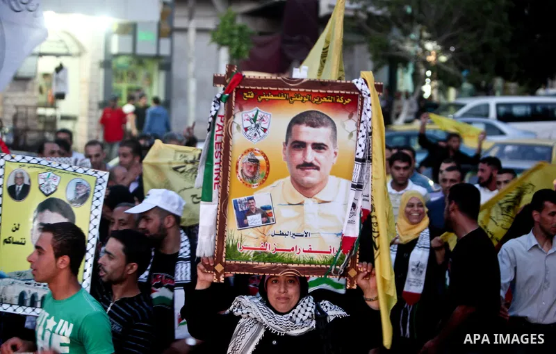 Relatives of Palestinian prisoners held in Israeli jails celebrate after the signing of a deal to end the prisoners hunger strike in Gaza City on 14 May 2012. Israel and Palestinian signed an agreement 14 May ending a ma...