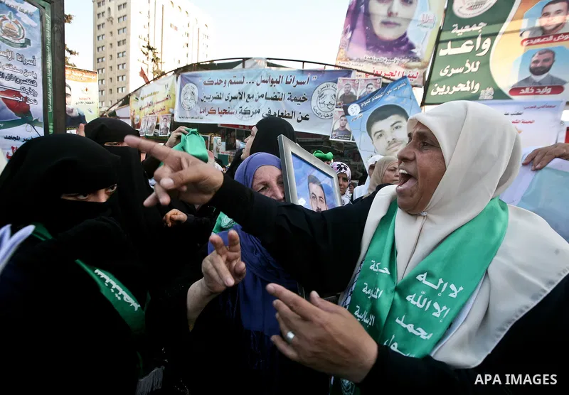 Relatives of Palestinian prisoners held in Israeli jails celebrate after the signing of a deal to end the prisoners hunger strike in Gaza City on 14 May 2012. Israel and Palestinian signed an agreement 14 May ending a ma...