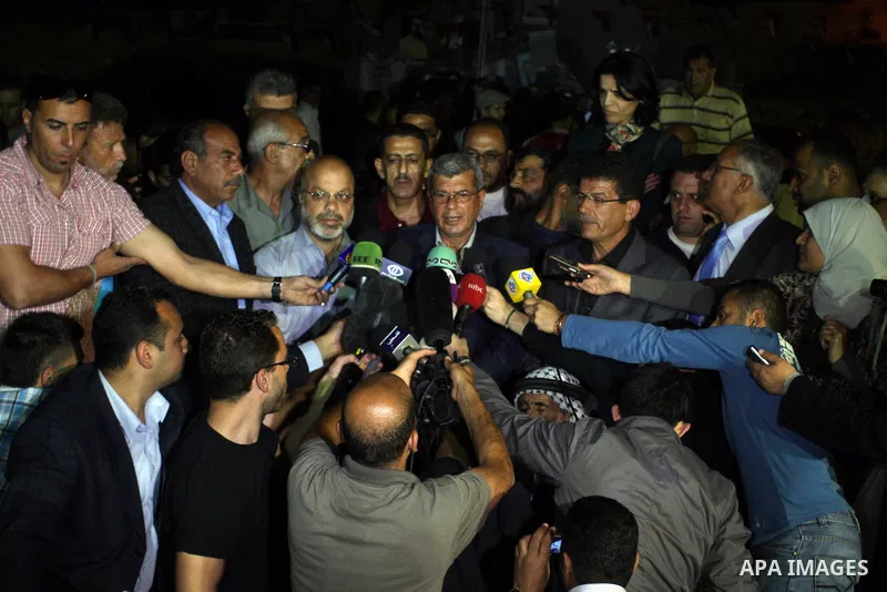 Palestinian prisoners minister Issa Qaraqaa speaks to the press in the West Bank city of Ramallah on May 14, 2012 to announce that Palestinian prisoners on hunger strike have agreed a deal with Israel to end their fast i...