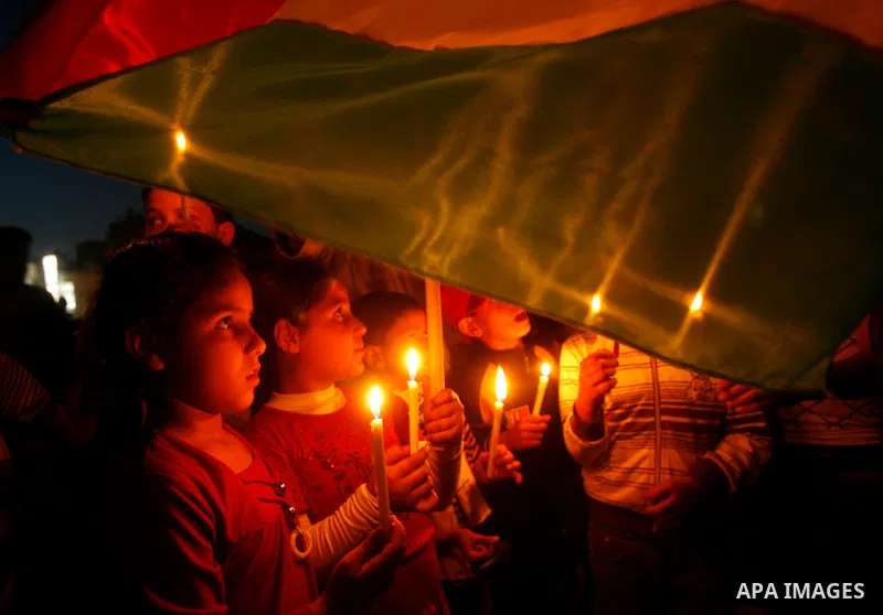 Palestinian children hold candles during a rally in Khan Younis in the southern Gaza Strip, ahead of Nakba May 14, 2012. On May 15 Palestinians will mark Nakba, or catastrophe, of Israel's founding in a 1948 war, when hu...