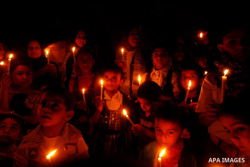 Palestinian children hold candles during a rally in Khan Younis in the southern Gaza Strip, ahead of Nakba May 14, 2012. On May 15 Palestinians will mark Nakba, or catastrophe, of Israel's founding in a 1948 war, when hu...