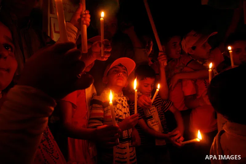 Palestinian children hold candles during a rally in Khan Younis in the southern Gaza Strip, ahead of Nakba May 14, 2012. On May 15 Palestinians will mark Nakba, or catastrophe, of Israel's founding in a 1948 war, when hu...