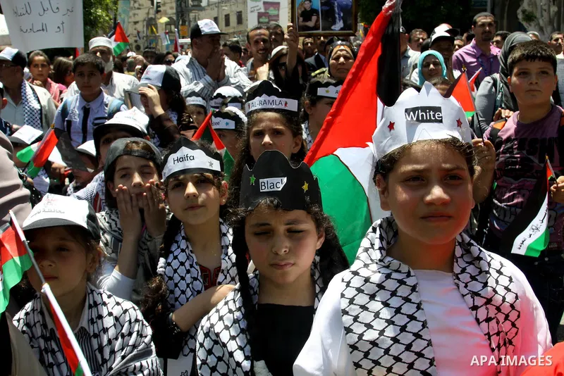 Palestinians take part in a demonstration to mark the 64th anniversary of "Nakba" (catastrophe), in the West Bank city of Nablus, on May 15, 2012. 'Nakba' Day for the Palestinians is an annual day of commemoration of the...