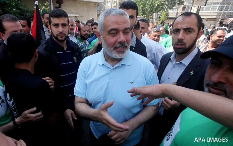 The head of Gaza's Hamas government, Ismail Haniya (blue polo shirt), takes part in a marathonin Gaza on May 15, 2012. 'Nakba' Day for the Palestinians is an annual day of commemoration of the displacement that followed...