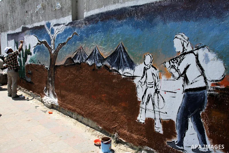 Palestinian artists paint murals marking Nakba in Gaza City May 15, 2012. Palestinians mark Nakba, or catastrophe, of Israel's founding in a 1948 war, when hundreds of thousands of their brethren fled or were forced to l...