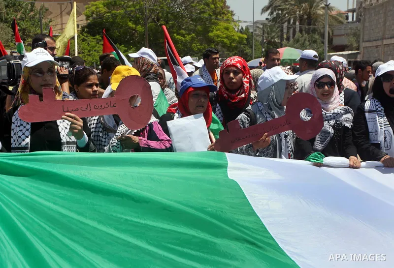 Palestinians participate in a rally marking Al-Nakba, commemorating the displacement of Palestinians in 1948 due to the declaration of the state of Israel, in Gaza City, Gaza Strip, 15 May 2012. Thousands marched in the...