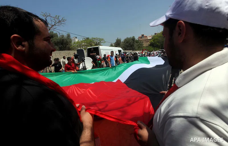 Palestinians participate in a rally marking Al-Nakba, commemorating the displacement of Palestinians in 1948 due to the declaration of the state of Israel, in Gaza City, Gaza Strip, 15 May 2012. Thousands marched in the...