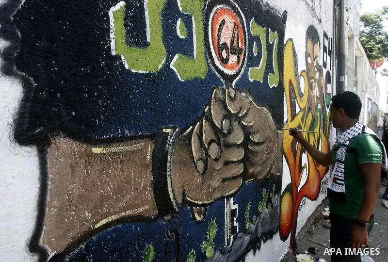 Palestinian artists paint murals marking Nakba in Gaza City May 15, 2012. Palestinians mark Nakba, or catastrophe, of Israel's founding in a 1948 war, when hundreds of thousands of their brethren fled or were forced to l...