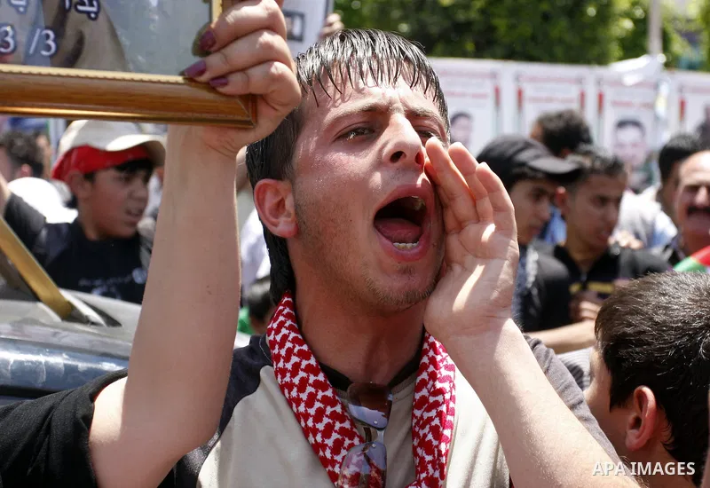 Palestinians participate in a rally marking the 64th anniversary of "Nakba", Arabic for catastrophe, the term used to mark the events leading to Israel's founding in 1948, in the West Bank city of Nablus, Tuesday, May 15...