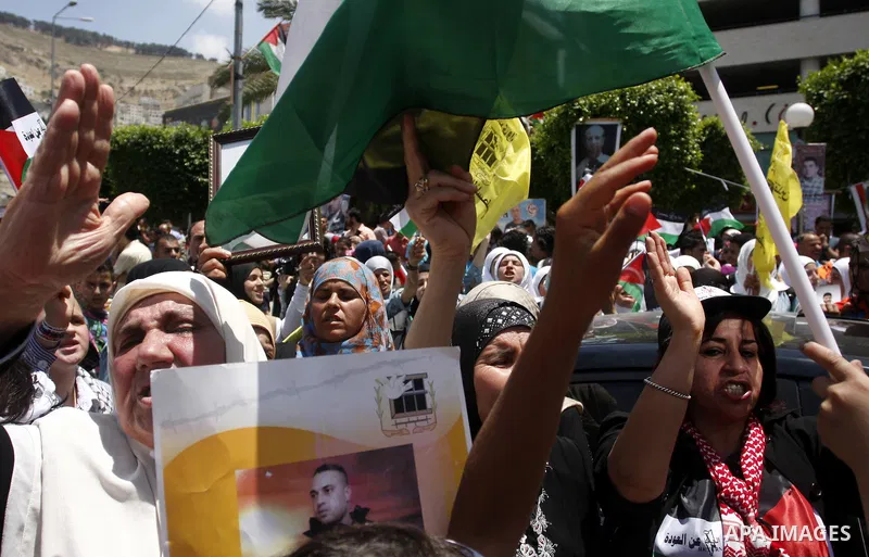 Palestinian women shout slogans against Israel during a rally marking the 64th anniversary of the 'Nakba' ('catastrophe') in Nablus, the West Bank, 15 May 2012. Thousands marched in the West Bank and Gaza Strip, commemor...