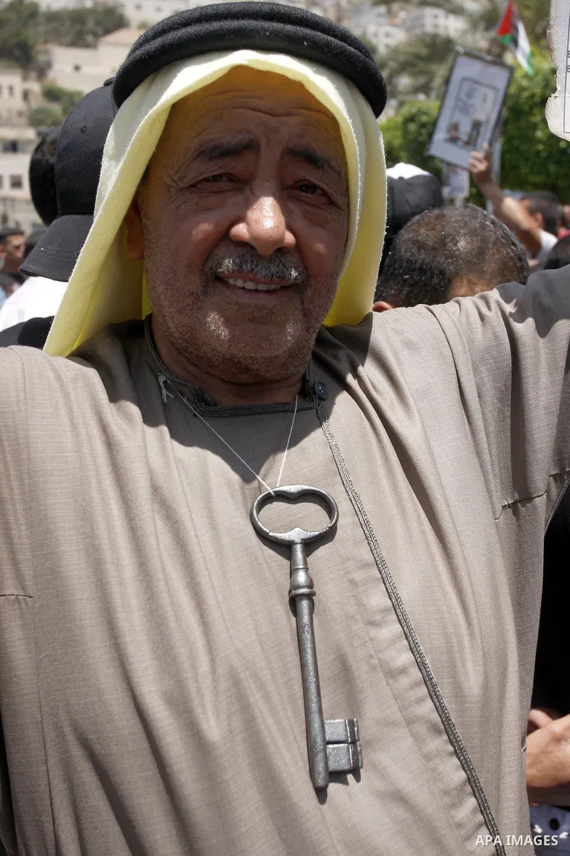Palestinians hold certificate during a protest marking the anniversary of the "Nakba", Arabic for catastrophe , during a rally marking the 64rd anniversary of the Nakba, or catastrophe, the Arabic term used to describe t...