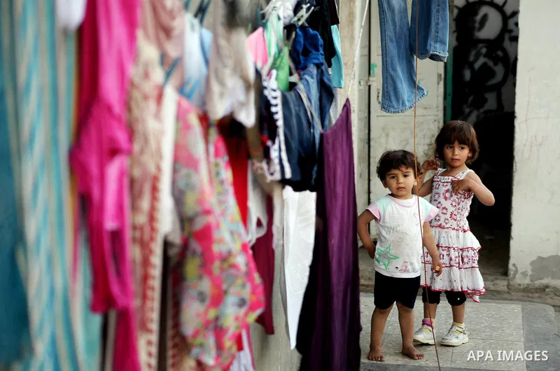 Palestinian children play in front of their homes in the Shati Palestinian refugee camp in Gaza City on May 15, 2012, as Palestinians and Arab-Israelis marked Nakba day, which commemorates the exodus of hundreds of thous...