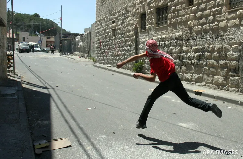 Palestinian stone-throwers clash with Israeli police in the East Jerusalem neighbourhood of Issawiya May 15, 2012. Israeli security forces were on high alert for violence on Tuesday, the day when Palestinians mark "Nakba...
