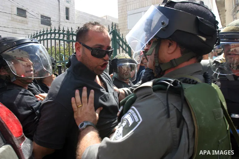 Israeli police officers detain a Palestinian after minor clashes between Palestinian stone-throwers and police in the East Jerusalem neighbourhood of Issawiya May 15, 2012. Israeli security forces were on high alert for...