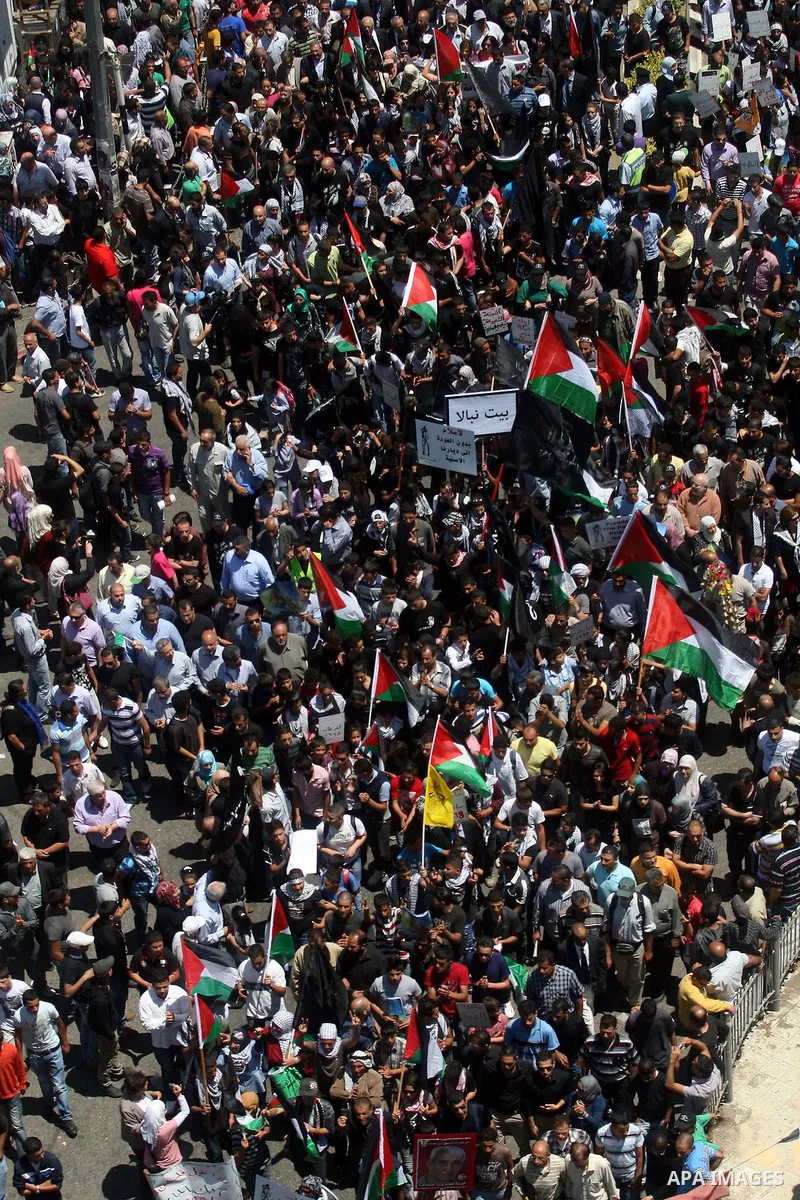 Palestinians attend a rally marking Al-Nakba Day in the West Bank city of Ramallah, on May 15, 2012. The Palestinians continued to rally in the West Bank and the Gaza Strip to mark al- Nakba Day when thousands of Palesti...