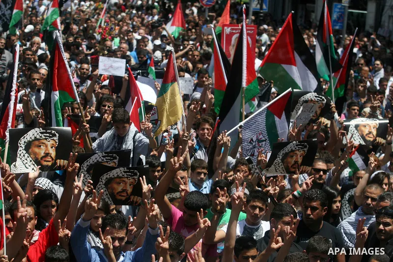 Palestinians attend a rally marking Al-Nakba Day in the West Bank city of Ramallah, on May 15, 2012. The Palestinians continued to rally in the West Bank and the Gaza Strip to mark al- Nakba Day when thousands of Palesti...