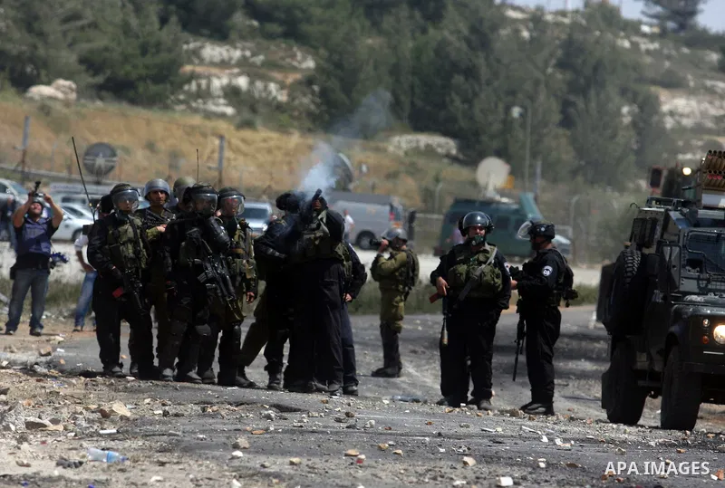 Israeli border police fires tear gas towards Palestinian protesters, during clashes on Nakba Day near Ofer prison, near Ramallah, the West Bank, 15 May 2012. Thousands marched in the West Bank and Gaza Strip, commemorati...