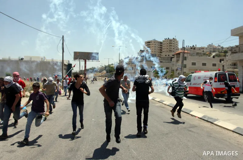 Palestinian protesters throw stones towards Israeli border police during clashes on Nakba Day near Ofer prison, near Ramallah, the West Bank, 15 May 2012. Thousands marched in the West Bank and Gaza Strip, commemorating...