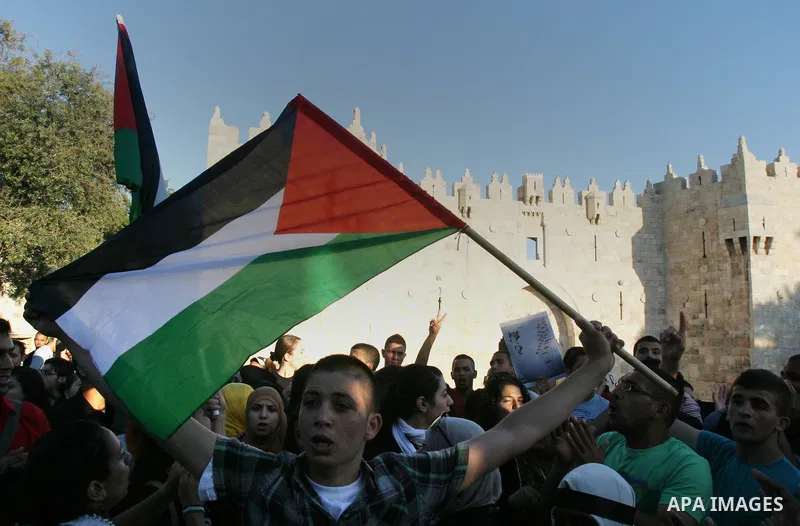 Palestinians protest outside Damascus gate in Jerusalem's Old City, during a 'Nakba Day' rally and march in East Jerusalem, 15 May 2012. Palestinians mark the Nakba, or the 'catastrophe', of israel's gaining statehood an...