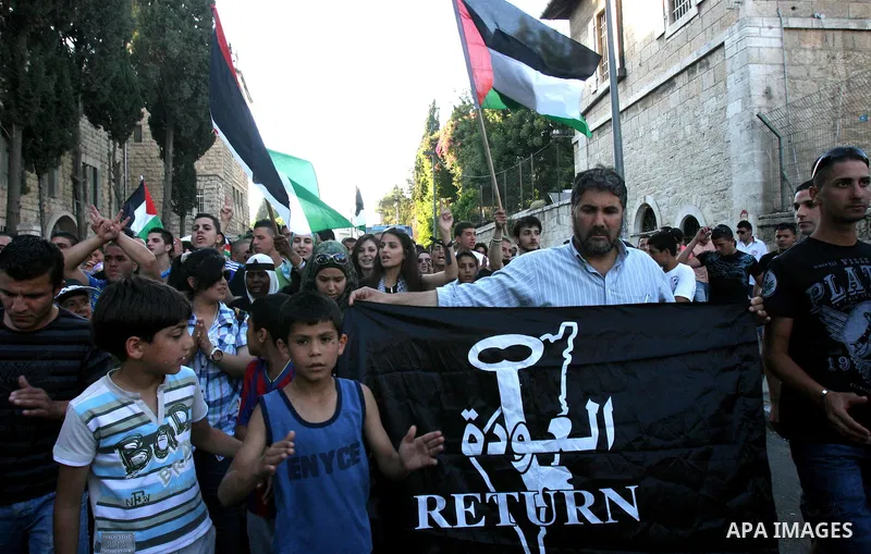 Palestinians protest outside Damascus gate in Jerusalem's Old City, during a 'Nakba Day' rally and march in East Jerusalem, 15 May 2012. Palestinians mark the Nakba, or the 'catastrophe', of israel's gaining statehood an...