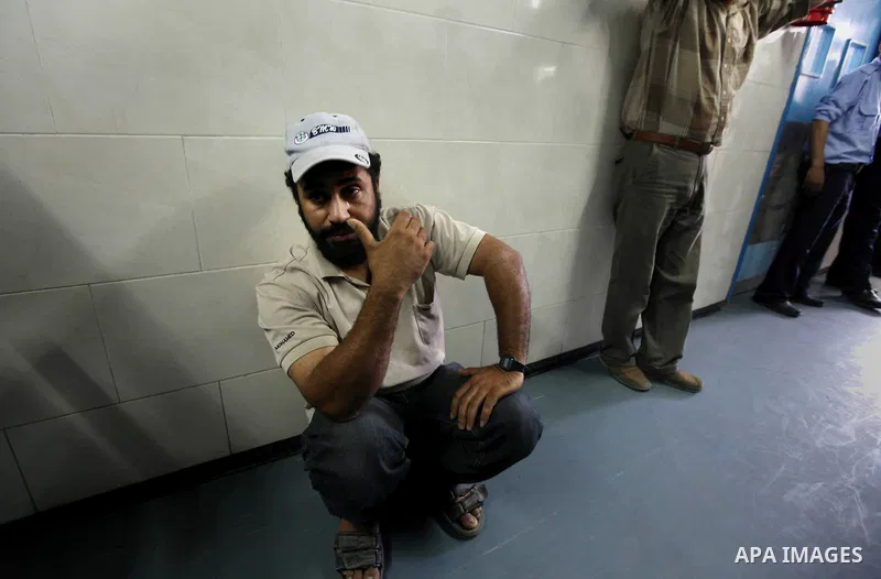 A Palestinian man waits for check up at a hospital in Gaza City on May 17, 2012, following Israeli shelling into the Gaza Strip in which seven people were wounded, two of them in critical condition, near the Karni crossi...