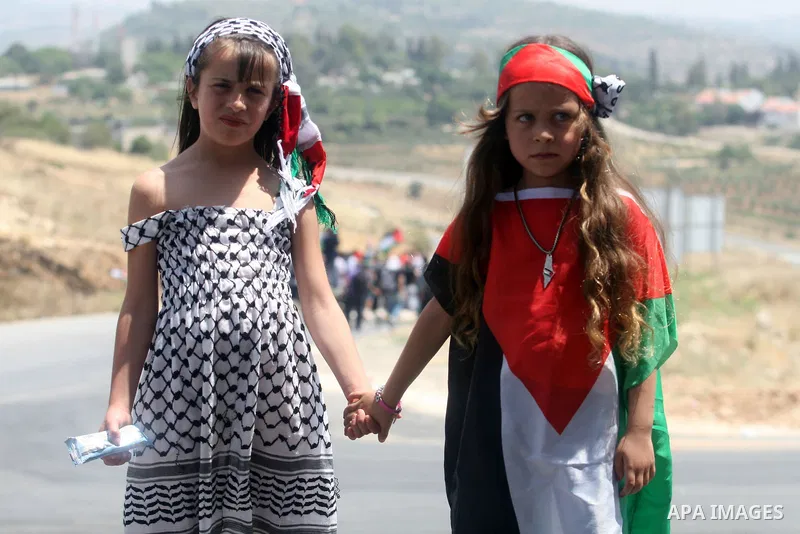 Palestinian children protest during a weekly demonstration in the West Bank, village of Nabi Saleh near Ramallah on Friday, May 18, 2012. Photo by Issam Rimawi