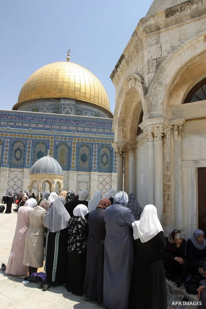 Palestinian worshippers pray outside the Dome of the Rock at the Al-Aqsa Mosque compound in in Jerusalem's old city on May 18, 2012. Photo by Mahfouz Abu Turk