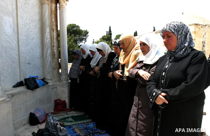 Palestinian worshippers pray outside the Dome of the Rock at the Al-Aqsa Mosque compound in in Jerusalem's old city on May 18, 2012. Photo by Mahfouz Abu Turk