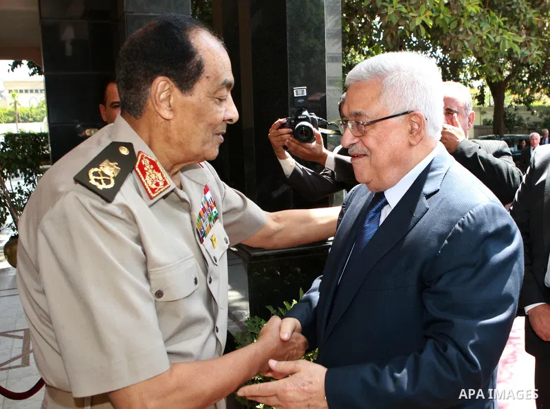 CAIRO, May 19, 2012 Photo released by the Palestinian presidency press office shows Palestinian President Mahmoud Abbas (R) shakes hands with the Head of Egypt's Higher Military Council Mohamad Hussein Tantawi before the...