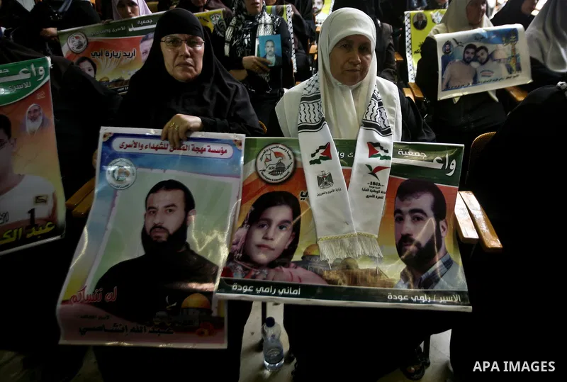 Relatives of Palestinian prisoners held in israeli jails attend a celebration to honor Palestinian journalists by Islamic Jihad movement in Gaza City on 19 May 2012. Photo by Ali Jadallah