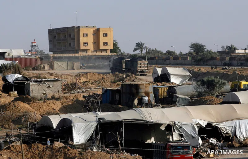 Palestinians transport goods by smuggling tunnels on the border between Egypt and Gaza in the southern Gaza Strip at the Rafah Refugee Camp on May 19, 2012. Living conditions in Gaza have deteriorated because of Israeli...