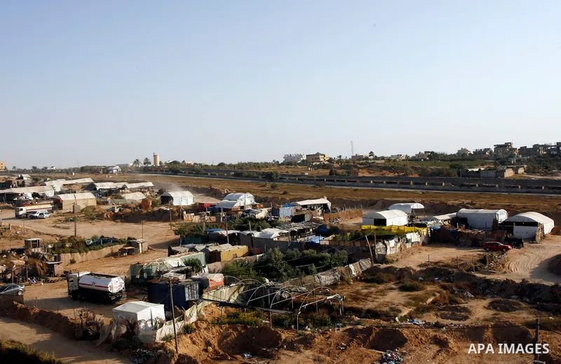 Palestinians transport goods by smuggling tunnels on the border between Egypt and Gaza in the southern Gaza Strip at the Rafah Refugee Camp on May 19, 2012. Living conditions in Gaza have deteriorated because of Israeli...