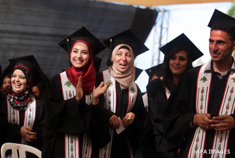 Palestinian students attend their graduation ceremony at the Birzeit University near the West Bank city of Ramallah. as some 3000 students received their degrees at the end of the academic year on May 19, 2012. Photo by...