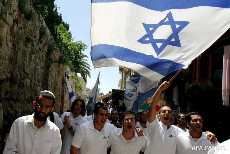 Israelis march and dance in the old city of Jerusalem on May 20, 2012 during Jerusalem Day celebrations marking the Jewish state's capture of the Arab eastern sector 45 years ago during the Six-Day War. Photo by Mahfouz...