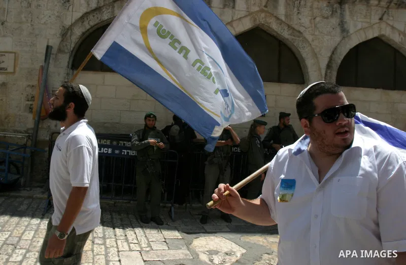 Israelis march and dance in the old city of Jerusalem on May 20, 2012 during Jerusalem Day celebrations marking the Jewish state's capture of the Arab eastern sector 45 years ago during the Six-Day War. Photo by Mahfouz...