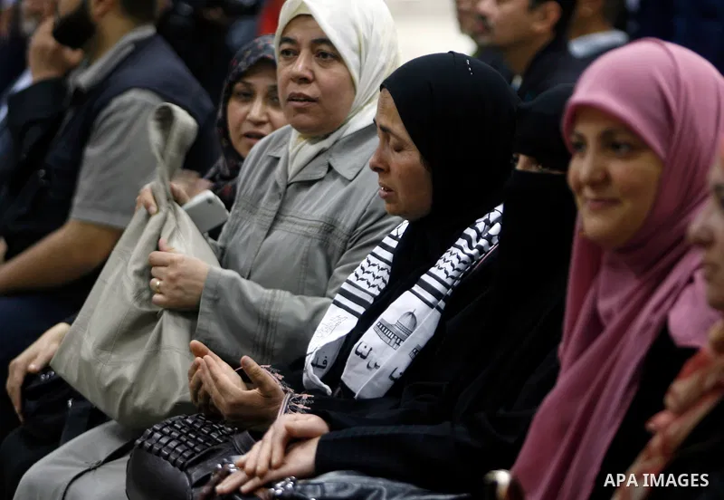 Palestinians receive the members of the convoy "Shad Al Rehal" from Global Coalition to support Jerusalem at the border between Egypt and Gaza in the southern Gaza Strip on May 20, 2012. the convoy have 68 solidarity of...