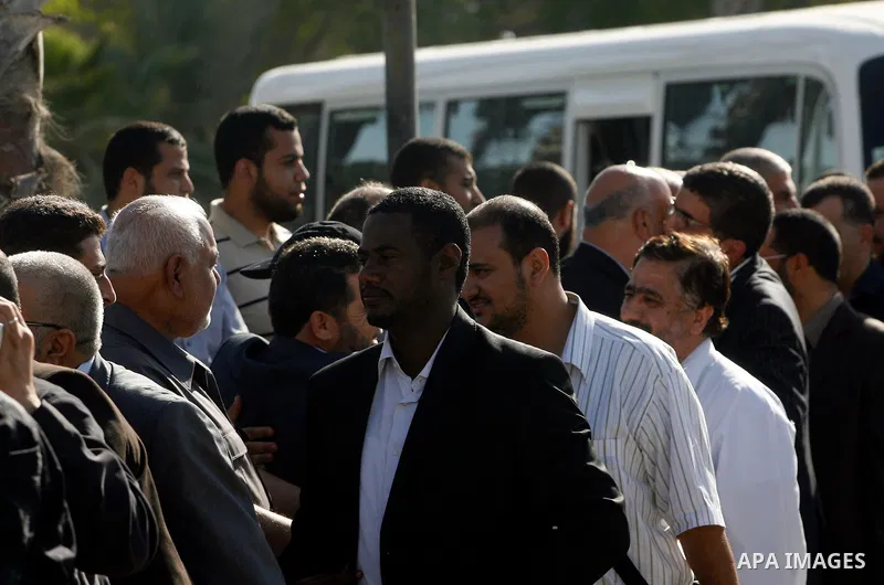Palestinians receive the members of the convoy "Shad Al Rehal" from Global Coalition to support Jerusalem at the border between Egypt and Gaza in the southern Gaza Strip on May 20, 2012. the convoy have 68 solidarity of...