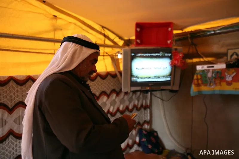 Palestinian Mohammed Nawaj'a at his tent which lit by project to generate alternative energy in his own land, near Jewish settlement of Susiya, in southern Hebron Khirbet Susiya, the West Bank on May 20, 2012. This proje...