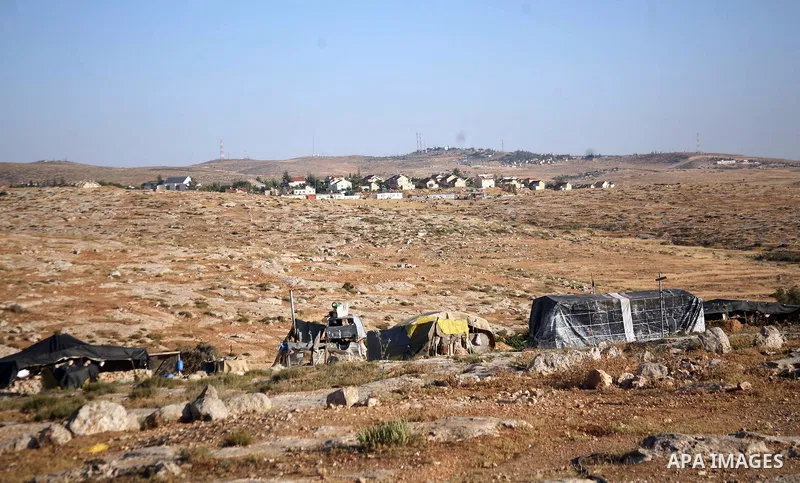 Palestinian Mohammed Nawaj'a inspects the project to generate alternative energy in his own land, near Jewish settlement of Susiya, in southern Hebron Khirbet Susiya, the West Bank on May 20, 2012. This projects was supp...