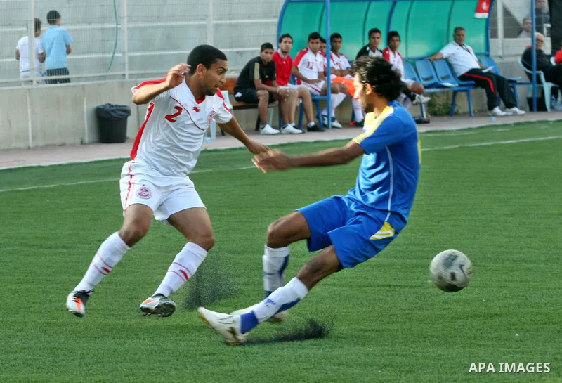 Tunisia and Sri Lanka footballers fight for possession during a football match. Tunisia and Sri Lanka footballers face-off during the Nakba Championship in the West Bank city of Nablus, on May 20, 2012. Nakba for the Pal...
