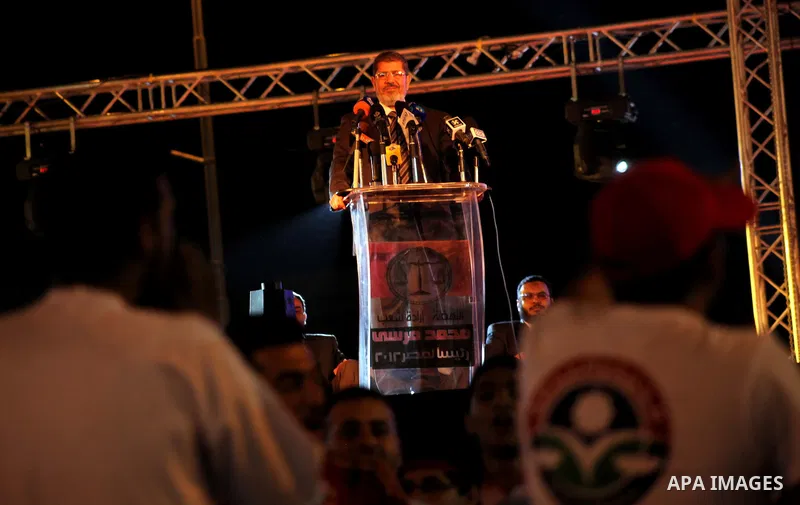 Mohamed Mursi, head of the Muslim Brotherhood's political party and the Brotherhood's presidential candidate, speaks during his last campaign rally in front of the Abdeen Palace Museum in Cairo May 20, 2012. Mursi has ca...