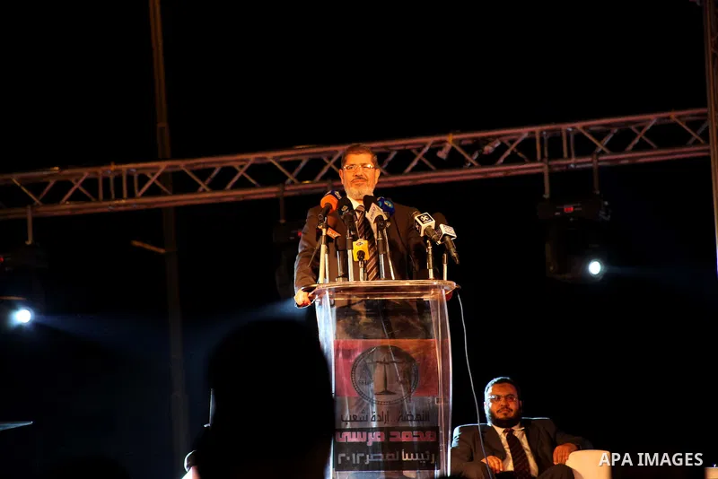 Mohamed Mursi, head of the Muslim Brotherhood's political party and the Brotherhood's presidential candidate, speaks during his last campaign rally in front of the Abdeen Palace Museum in Cairo May 20, 2012. Mursi has ca...