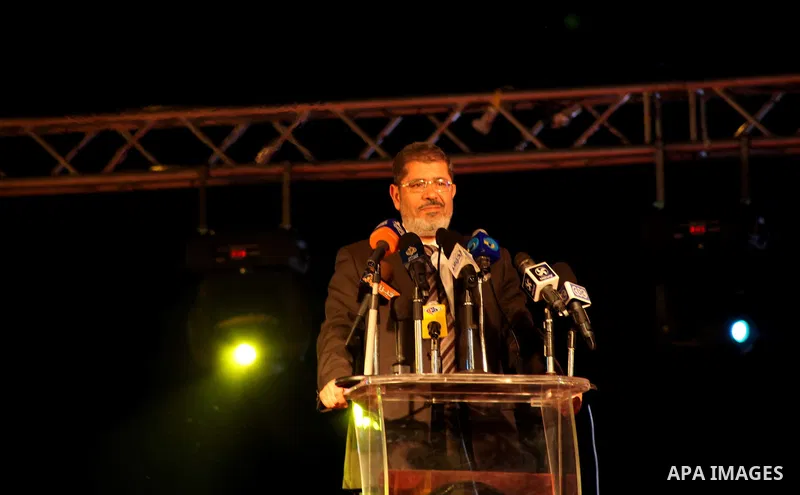 Mohamed Mursi, head of the Muslim Brotherhood's political party and the Brotherhood's presidential candidate, speaks during his last campaign rally in front of the Abdeen Palace Museum in Cairo May 20, 2012. Mursi has ca...