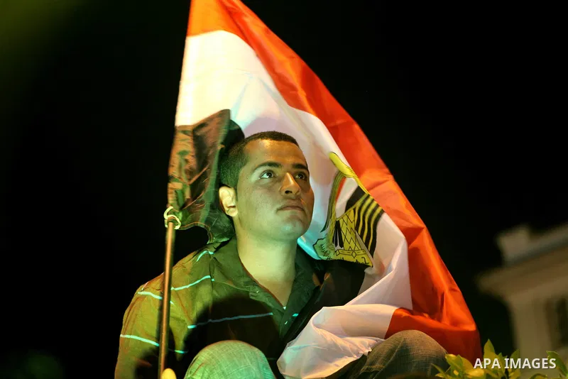 Supporters of the Muslim Brotherhood's presidential candidate Mohammed Mursi, unseen, hold a rally Cairo, Egypt, Sunday, May 20, 2012. Egypt's election commission is vowing that next week's presidential election will be...