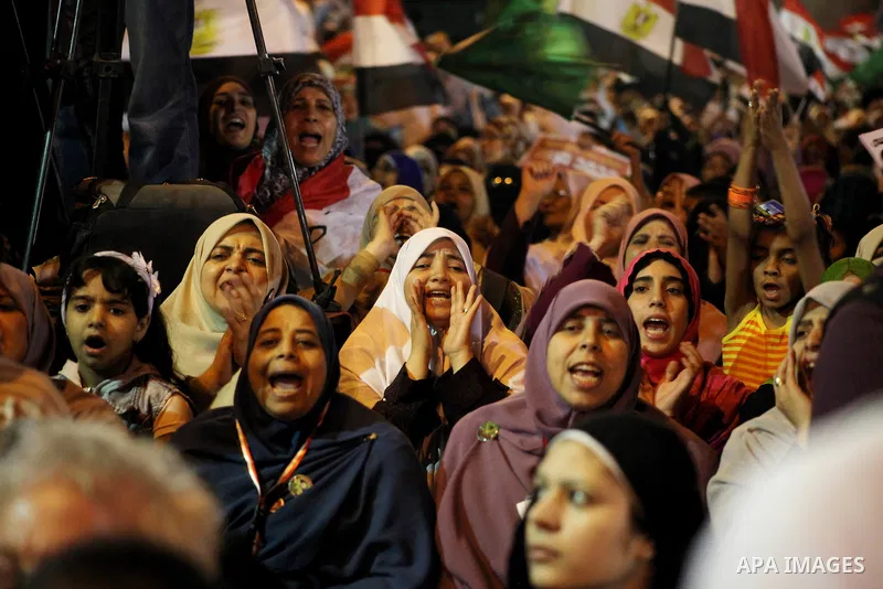 Supporters of the Muslim Brotherhood's presidential candidate Mohammed Mursi, unseen, hold a rally Cairo, Egypt, Sunday, May 20, 2012. Egypt's election commission is vowing that next week's presidential election will be...