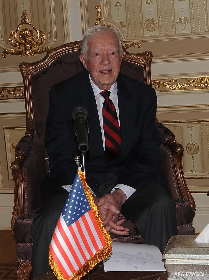 Former US president Jimmy Carter meets with Egyptian Parliament Speaker Saad al-Katatni in Cairo on May 21, 2012. Carter had arrived the previous day in Egypt with a delegation from his Carter Center to monitor Egypt's u...