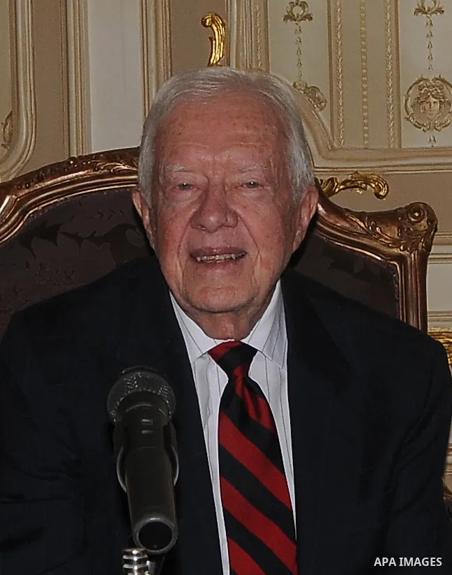 Former US president Jimmy Carter meets with Egyptian Parliament Speaker Saad al-Katatni in Cairo on May 21, 2012. Carter had arrived the previous day in Egypt with a delegation from his Carter Center to monitor Egypt's u...