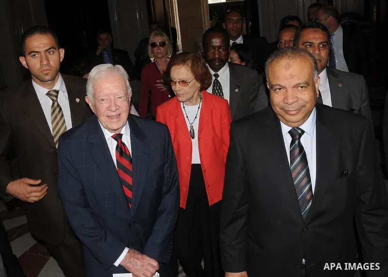 Egyptian Parliament Speaker Saad al-Katatni meets withs former US president Jimmy Carter in his office in Cairo on May 21, 2012. Carter had arrived the previous day in Egypt with a delegation from his Carter Center to mo...